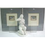 A white glazed pottery nude female figure, 13" high; & four decorative pictures, each in glazed