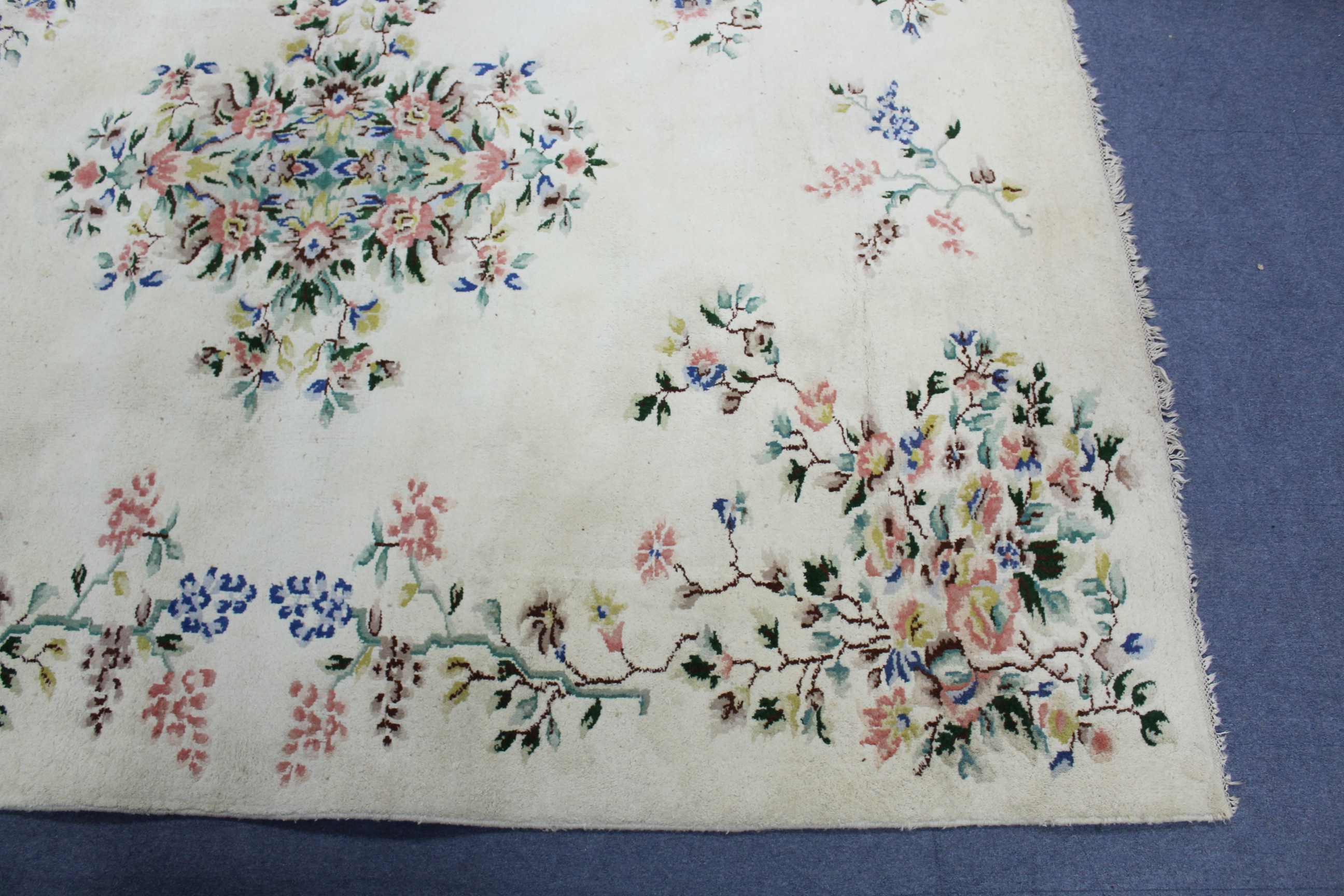 An Indian carpet of off-white ground & with all-over multicoloured floral design, 9' 7" x 12'. - Image 3 of 5