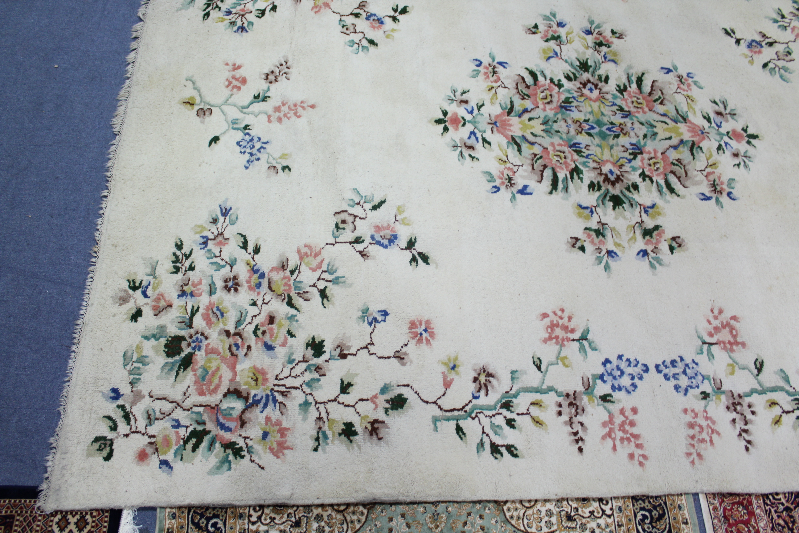 An Indian carpet of off-white ground & with all-over multicoloured floral design, 9' 7" x 12'. - Image 5 of 5