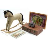 A child's rocking horse, 29" long x 30" high; together with a fibre-covered suitcase; a Roberts