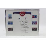 A Beijing 2008 GB Paralympics athlete shirt in glazed frame with indistinct signature & accompanying