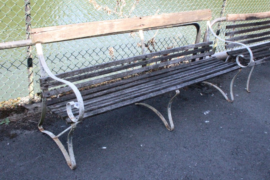 A teak slatted & white painted wrought-iron garden bench, 73½” long; a similar smaller garden bench,