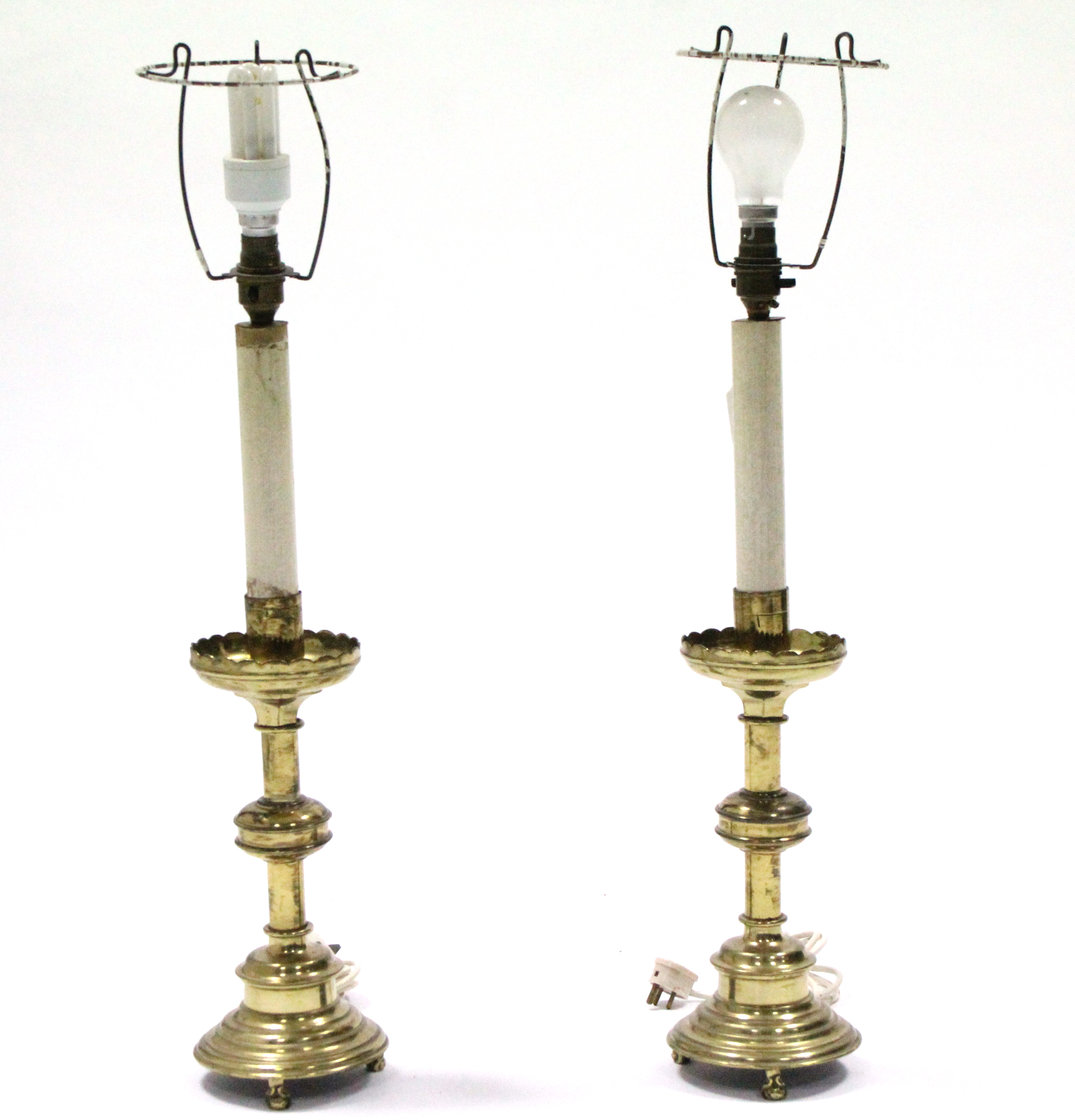 A pair of brass candle stands with lobed drip-pans, on round columns & circular bases with short - Image 2 of 3