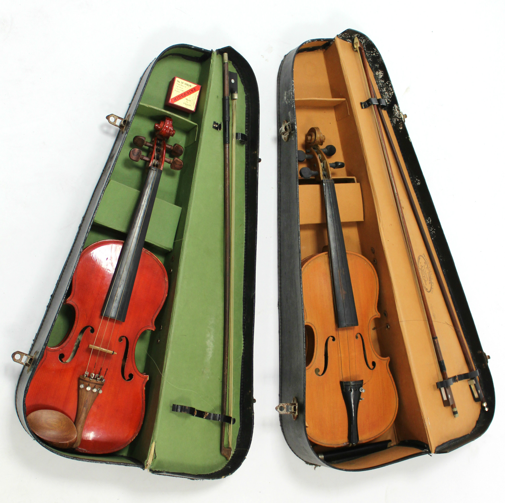 Two modern violins; three violin bows; & two violin cases.