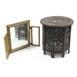 A Damascus carved wood circular occasional table on folding stand, 21" diam.; & a gilt frame