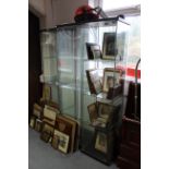 Three tall glazed shop display cabinets, each fitted three plate-glass shelves, 64½" high.