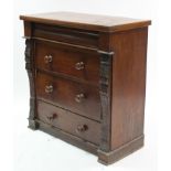A Victorian mahogany chest fitted four long graduated drawers with turned knob handles & with carved