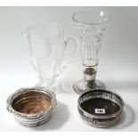 Two silver plated coasters, each with turned treen base; a cut-glass water jug; a similar vase; &