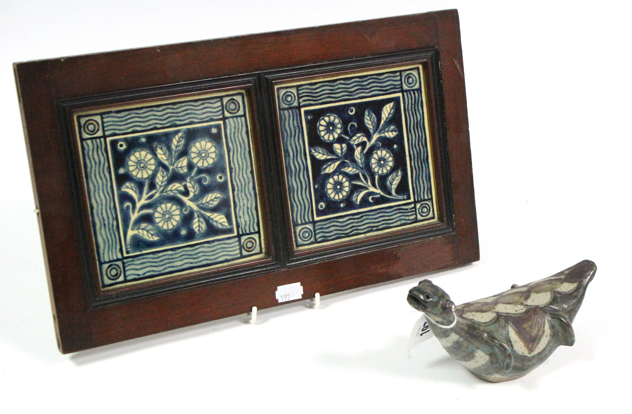 A South African pottery model of a seal, signed to base, 7½" wide, & a pair of blue & white floral