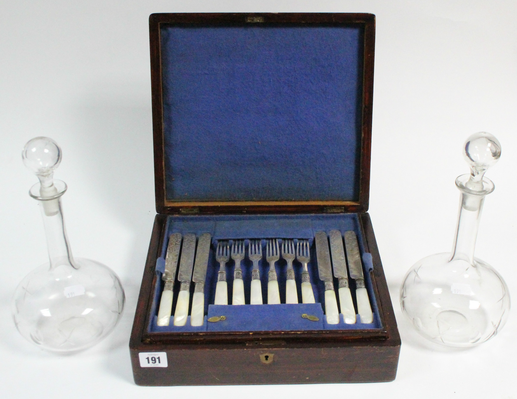A set of twelve Victorian engraved plated dinner knives & forks with mother-of-pearl handles, & in
