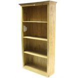 A painted wood tall standing open four-tier bookcase, 38½" wide x 71" high.