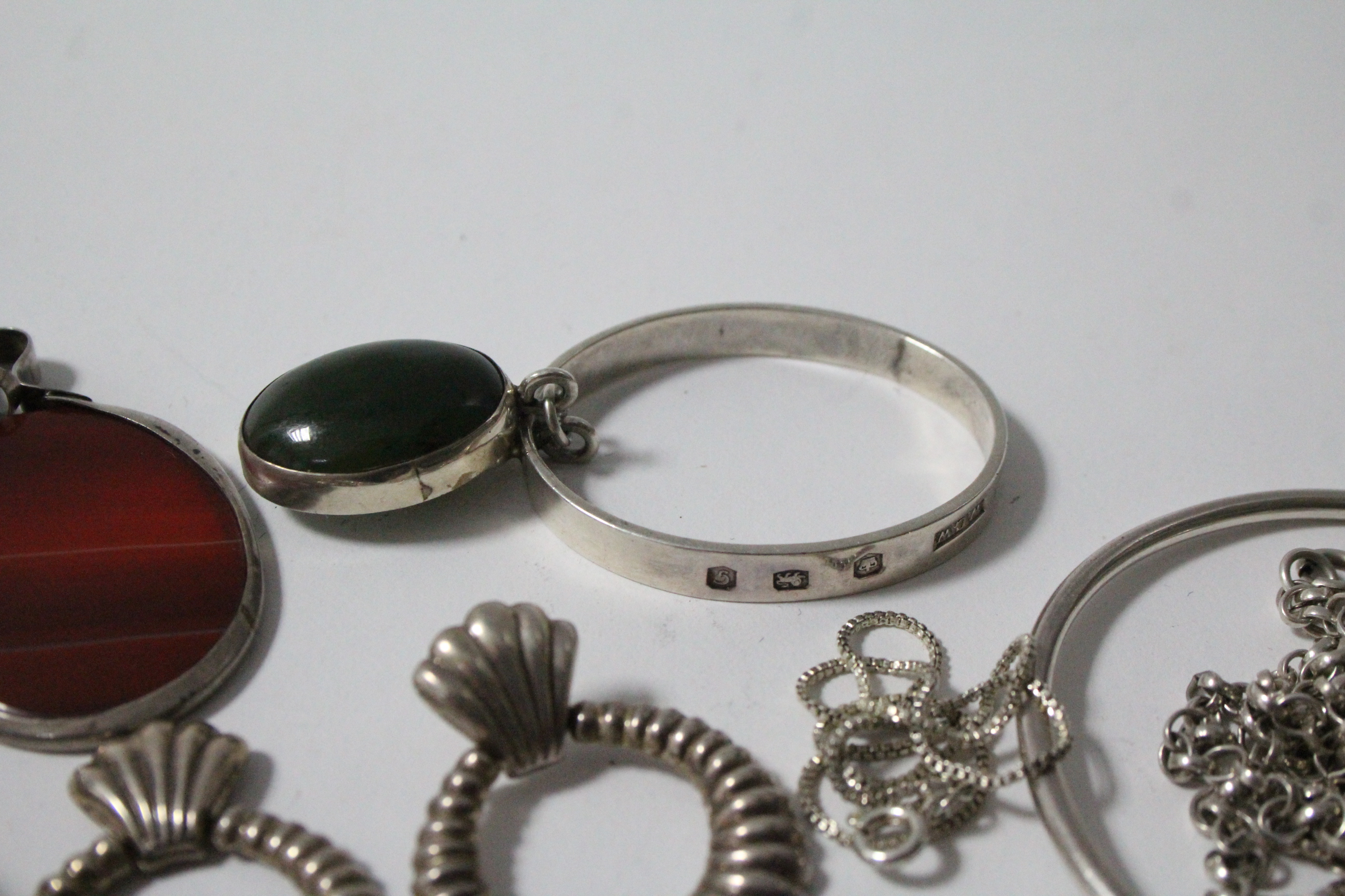 Two 9ct. gold brooches; a gilded silver bracelet; two silver bracelets; a silver hinged - Image 4 of 4