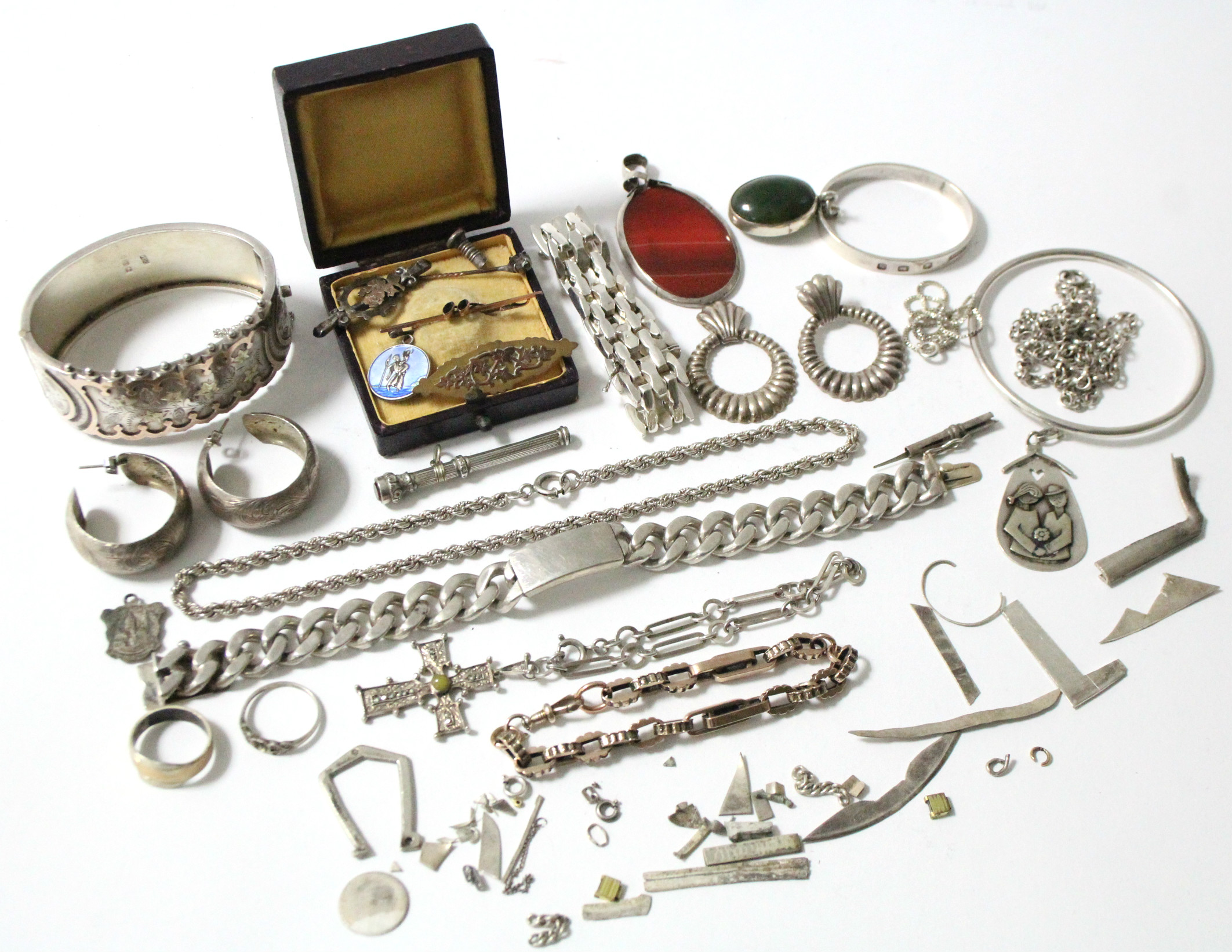 Two 9ct. gold brooches; a gilded silver bracelet; two silver bracelets; a silver hinged