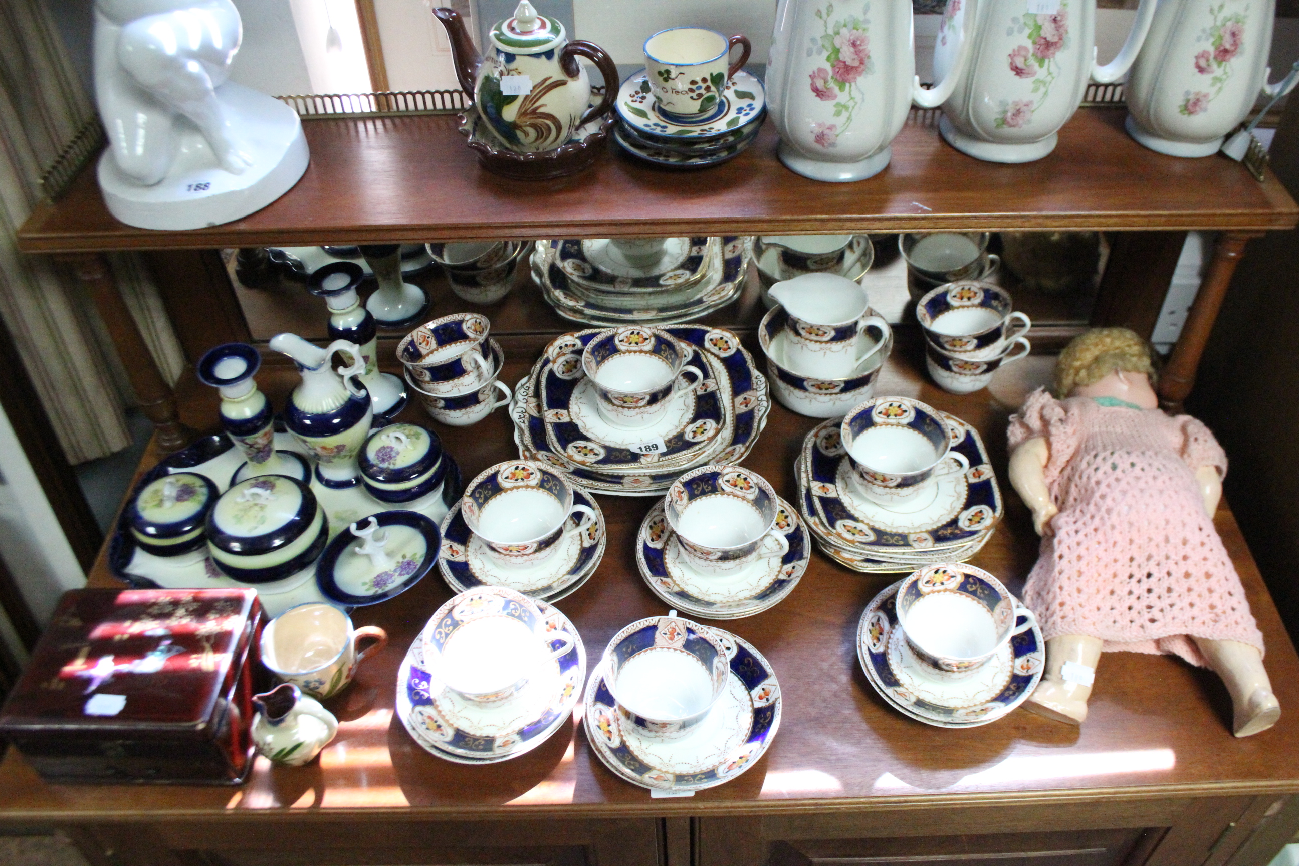 A Victorian china floral decorated extensive thirty-four piece part tea service; a set of three