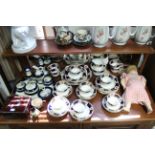 A Victorian china floral decorated extensive thirty-four piece part tea service; a set of three