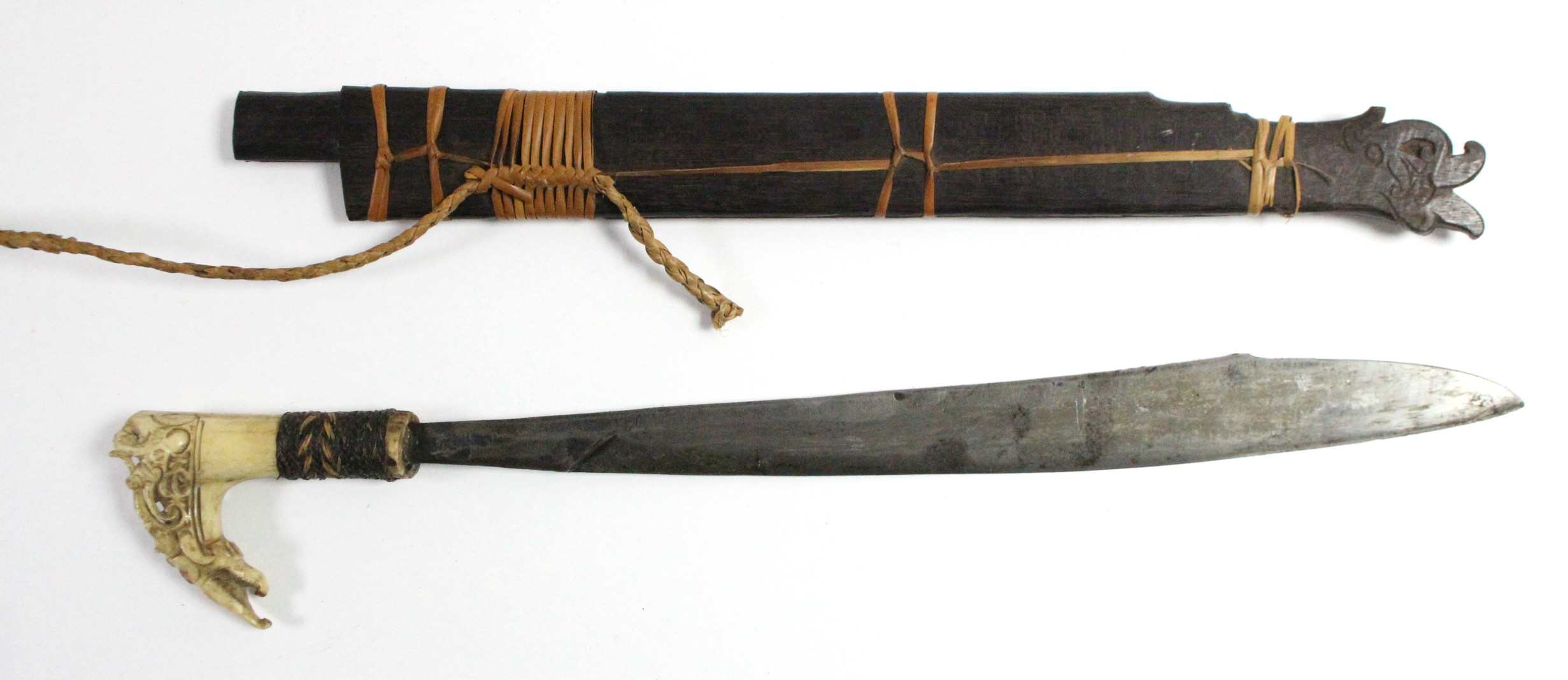 A Borneon ceremonial knife with 18½” long single-edge curved blade, with carved bone handle, & - Image 2 of 5
