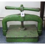 A green painted cast-iron book press, 11¾” x 9¾”.