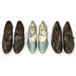 A pair of circa 1920’s pale blue satin ladies’ shoes with diamante button fasteners by Clarks of