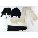 An early 20th century navy silk blouse; a black Jap silk ditto; two lace ditto; a cream figured silk