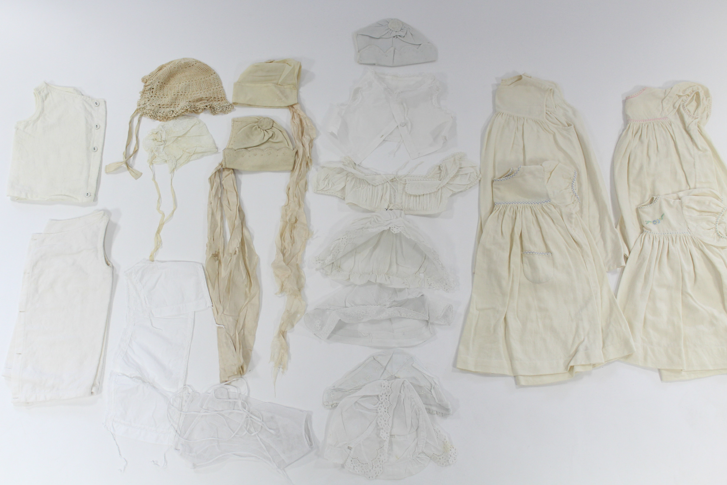 Five early 20th century cream flannel wrappers; two hand-knitted cream wool shawls; five circa - Image 3 of 5