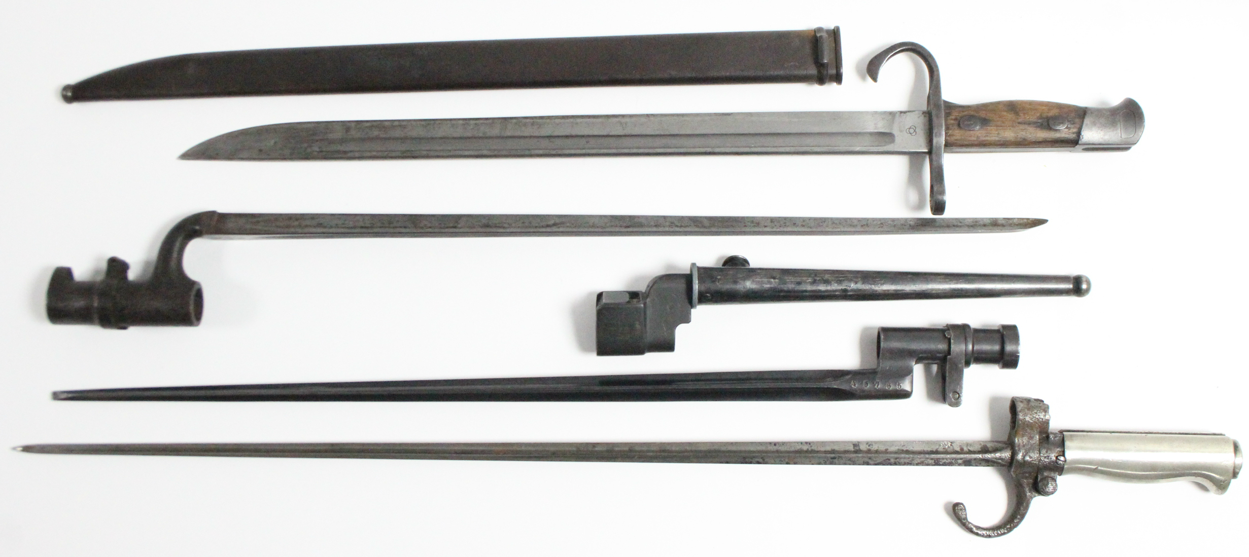 A WWII rifle bayonet with 15½” long single-edge curved blade, with treen grip, & with steel