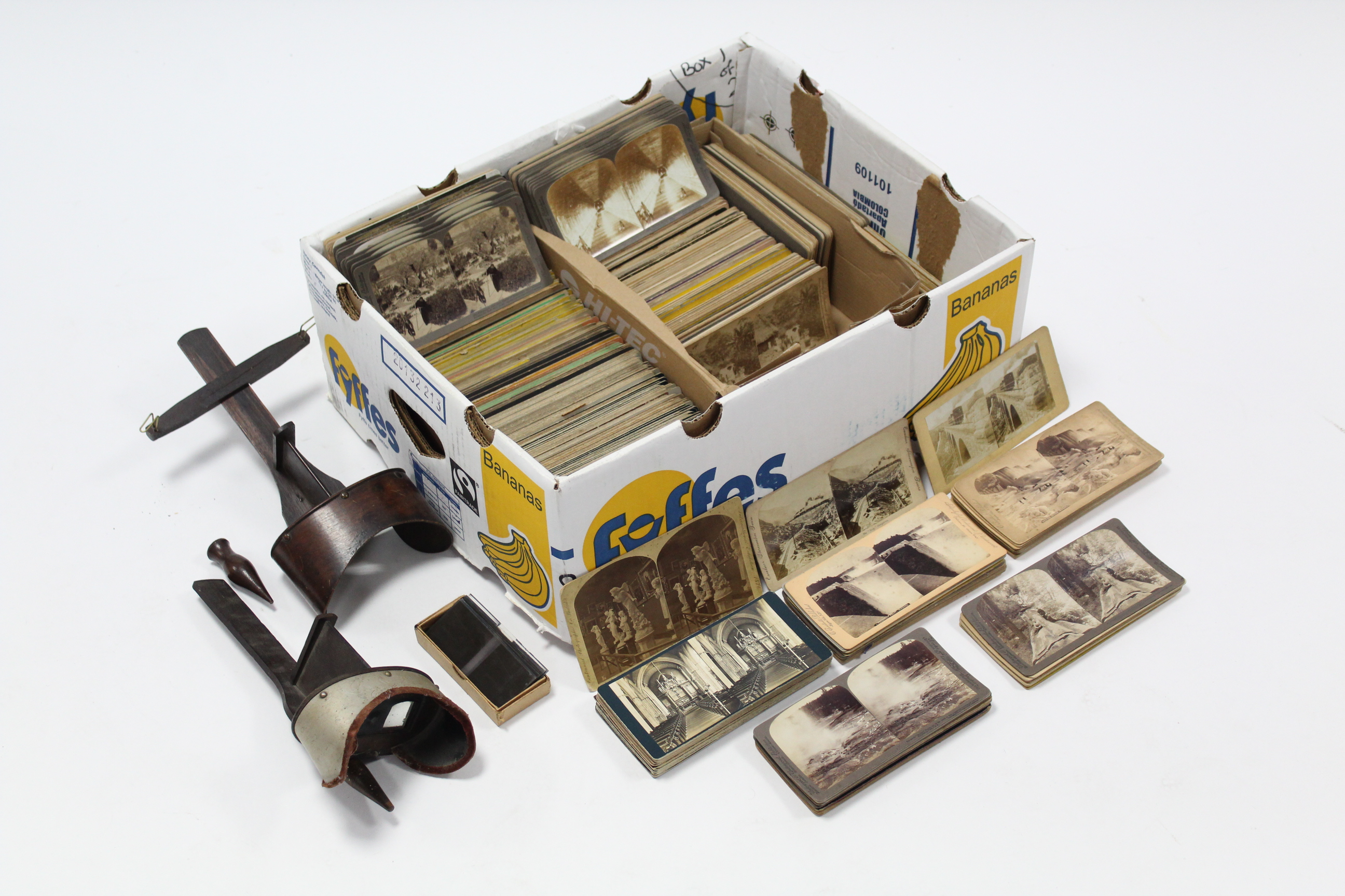 Two hand-held stereo-card viewers; & approximately three hundred various stereograph cards.