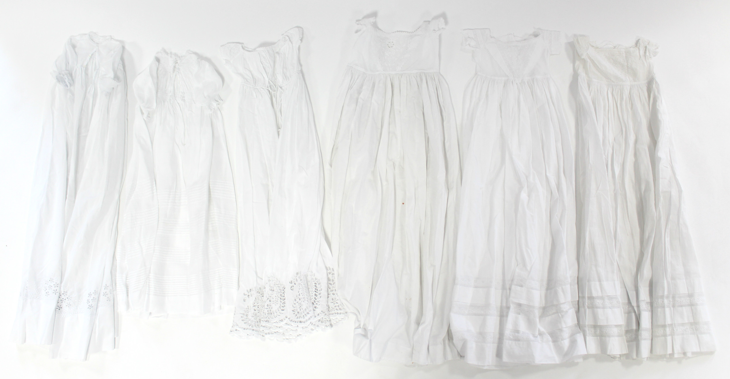 Twelve various early 20th century babies’ embroidered white cotton short gowns; - Image 2 of 3