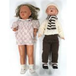 An Armand Marseille composition boy doll, w.a.f.; & a similar girl doll, both 26½” tall.