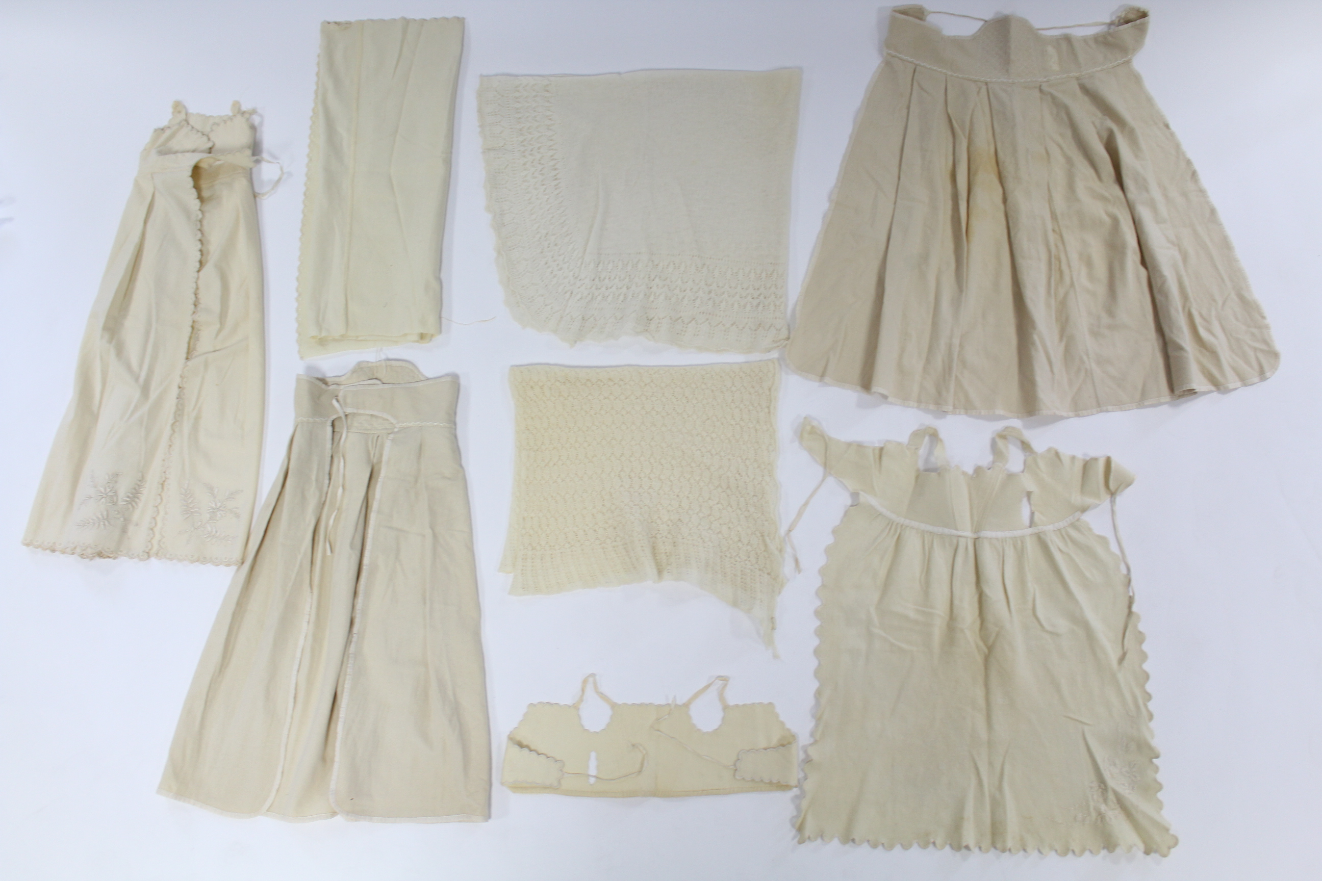 Five early 20th century cream flannel wrappers; two hand-knitted cream wool shawls; five circa - Image 4 of 5