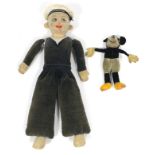 A 1930’s Dean’s Rag book Mickey Mouse soft toy (with replacement eye) with button to back (Reg No.