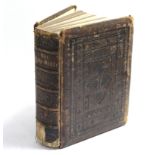 A 19th century Holy Bible in gilt-tooled leather binding.