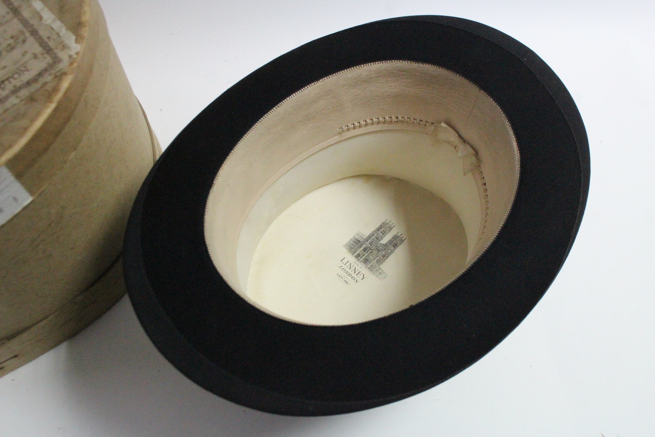 A Linney of London black silk top hat; with a contemporary oval cardboard hat box. Provenance: The - Image 2 of 2