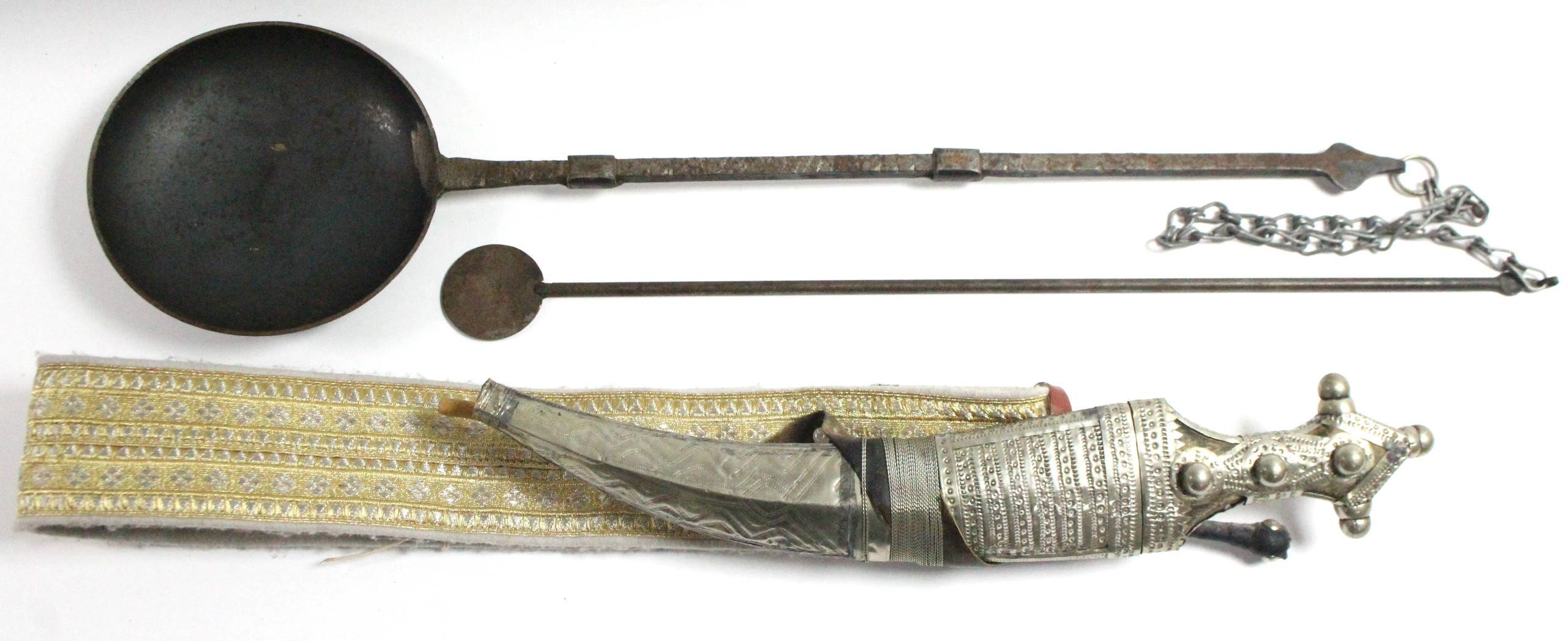 A Saudi Arabian dress dagger with sheath & belt; & a Bedouin iron coffee roaster.