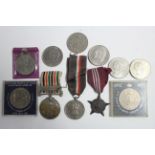 A large quantity of 6d coins (mostly post 1947); ten British commemorative crowns; a Punjab Police