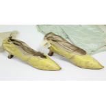 A pair of early 19th century yellow kid leather ladies shoes; & four early Victorian coloured silk