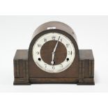 A 1930’s mantel clock with chiming movement, & in oak domed-top case, 9” high; & a small wall