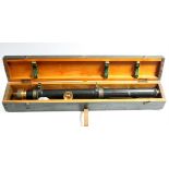 A WWII black lacquered sighting telescoping with brass fittings, 29½” long, in fitted case.