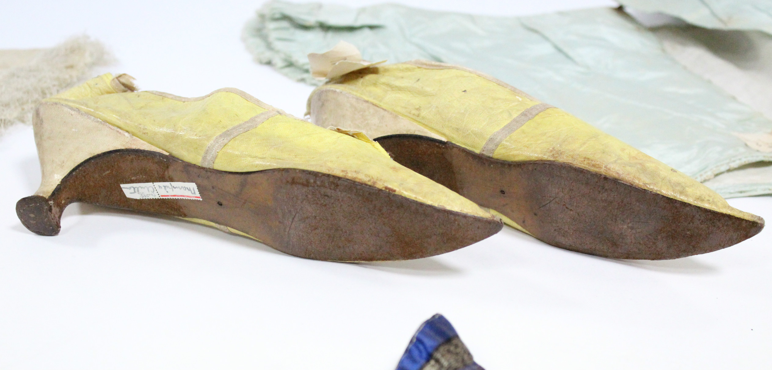 A pair of early 19th century yellow kid leather ladies shoes; & four early Victorian coloured silk - Image 3 of 3