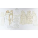 Five early 20th century cream flannel wrappers; two hand-knitted cream wool shawls; five circa