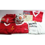 An Allstars Manchester United replica shirt autographed by Bobby Charlton, Harry Gregg, Kenny