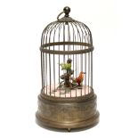 A modern Swiss singing bird in cage automaton by Reuge music (number15557).