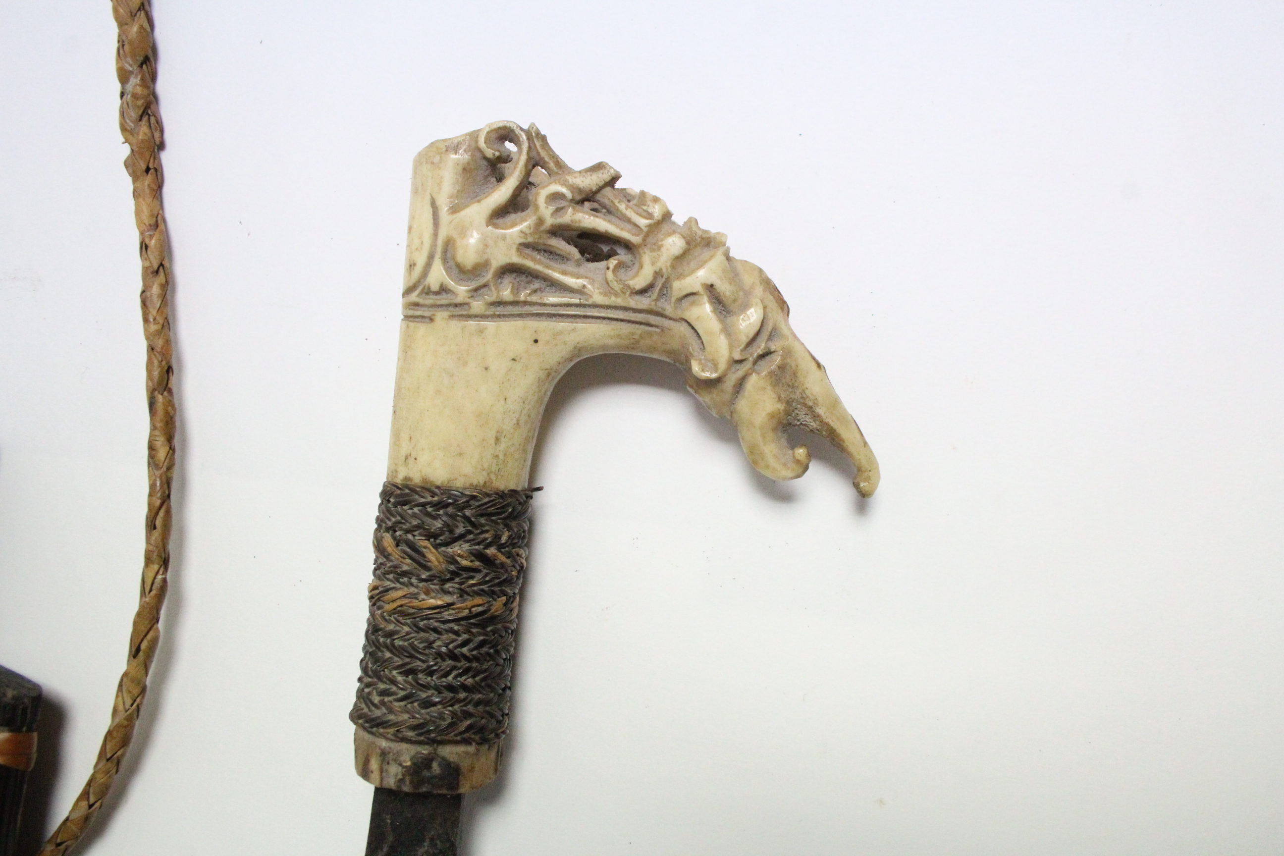 A Borneon ceremonial knife with 18½” long single-edge curved blade, with carved bone handle, & - Image 3 of 5