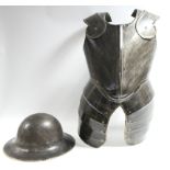 A steel safety helmet; & a replica armour breastplate.