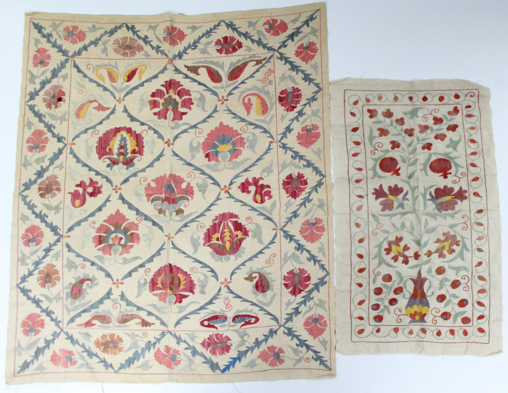 An Indian embroidered coverlet of cream ground, with multi-coloured stylised floral decoration, - Image 3 of 4