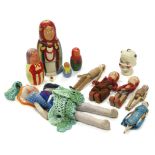 Five painted wooden peg dolls; a 1930’s cloth doll; a set of five wooden Russian dolls; & a