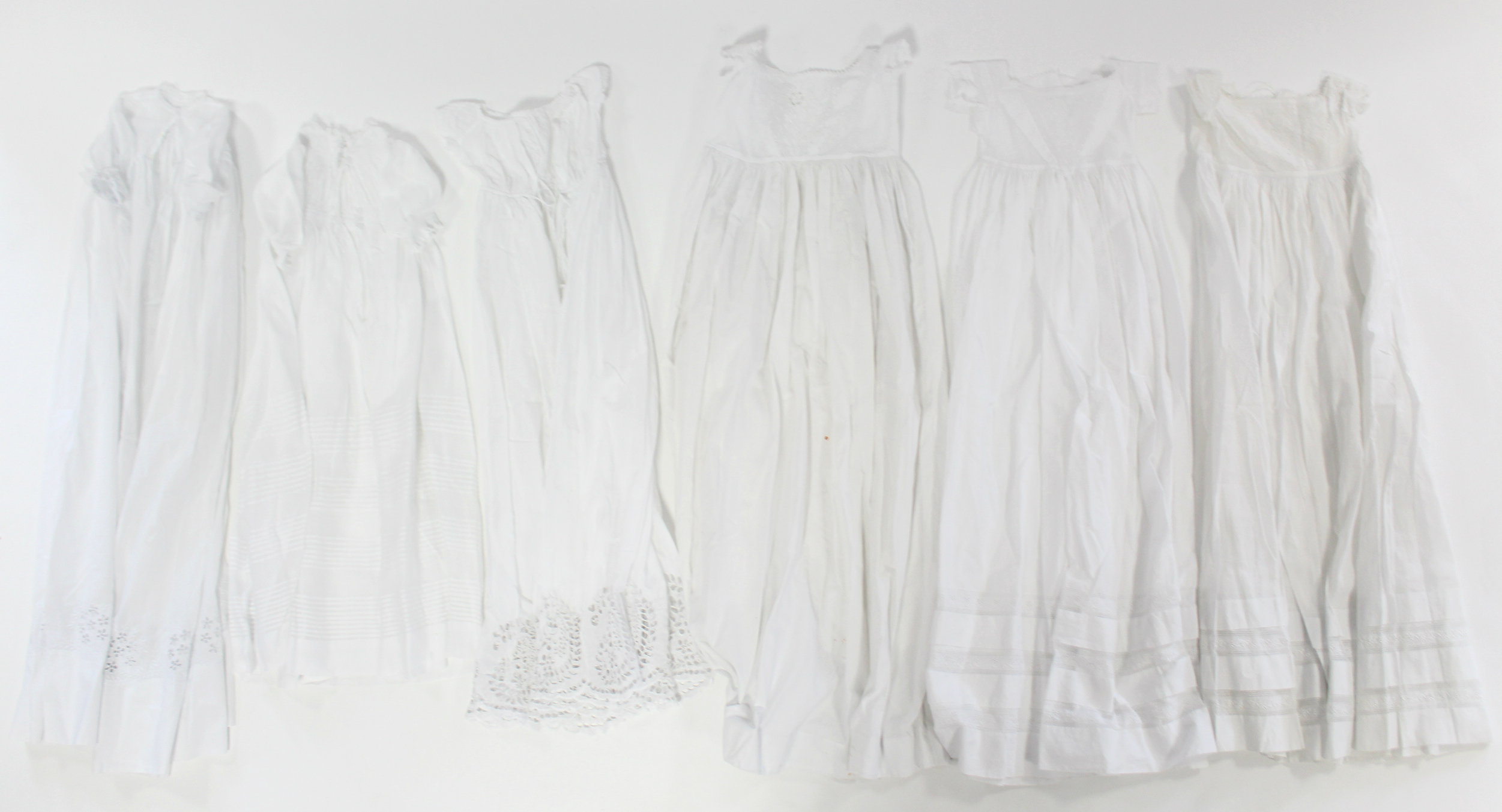 Twelve various early 20th century babies’ embroidered white cotton long gowns. - Image 2 of 2