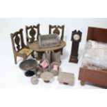 A doll’s house longcase clock, 12¾” high; a doll’s house oval dining table & three ditto chairs;