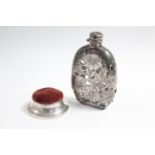 A George V silver pin cushion, 3¼” diam., Birmingham 1912; & a silver plated overlaid glass flask,