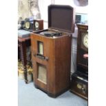 A mid-20th century floor-standing radiogram fitted Garrard turntable to the hinged lid, & in