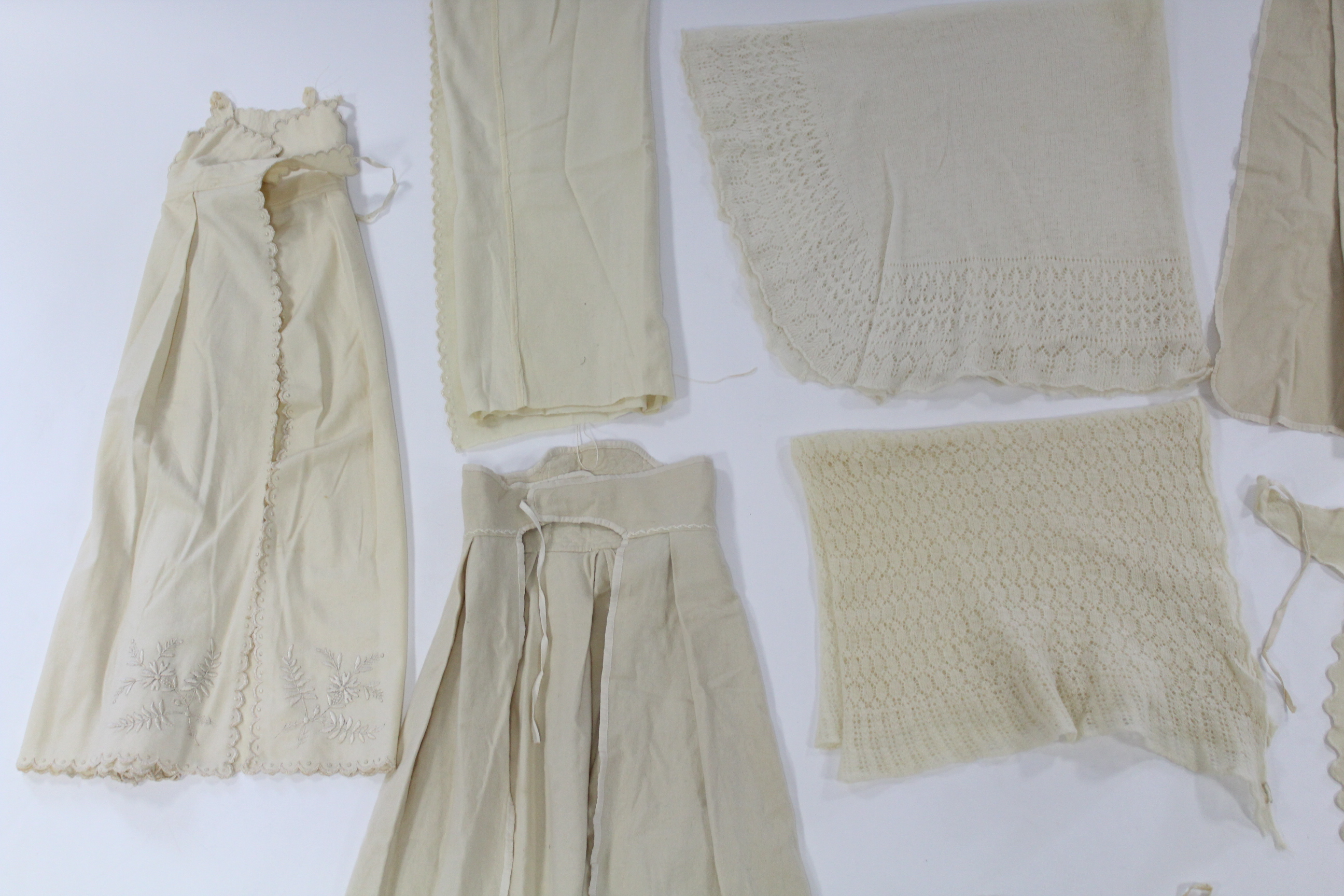 Five early 20th century cream flannel wrappers; two hand-knitted cream wool shawls; five circa - Image 5 of 5